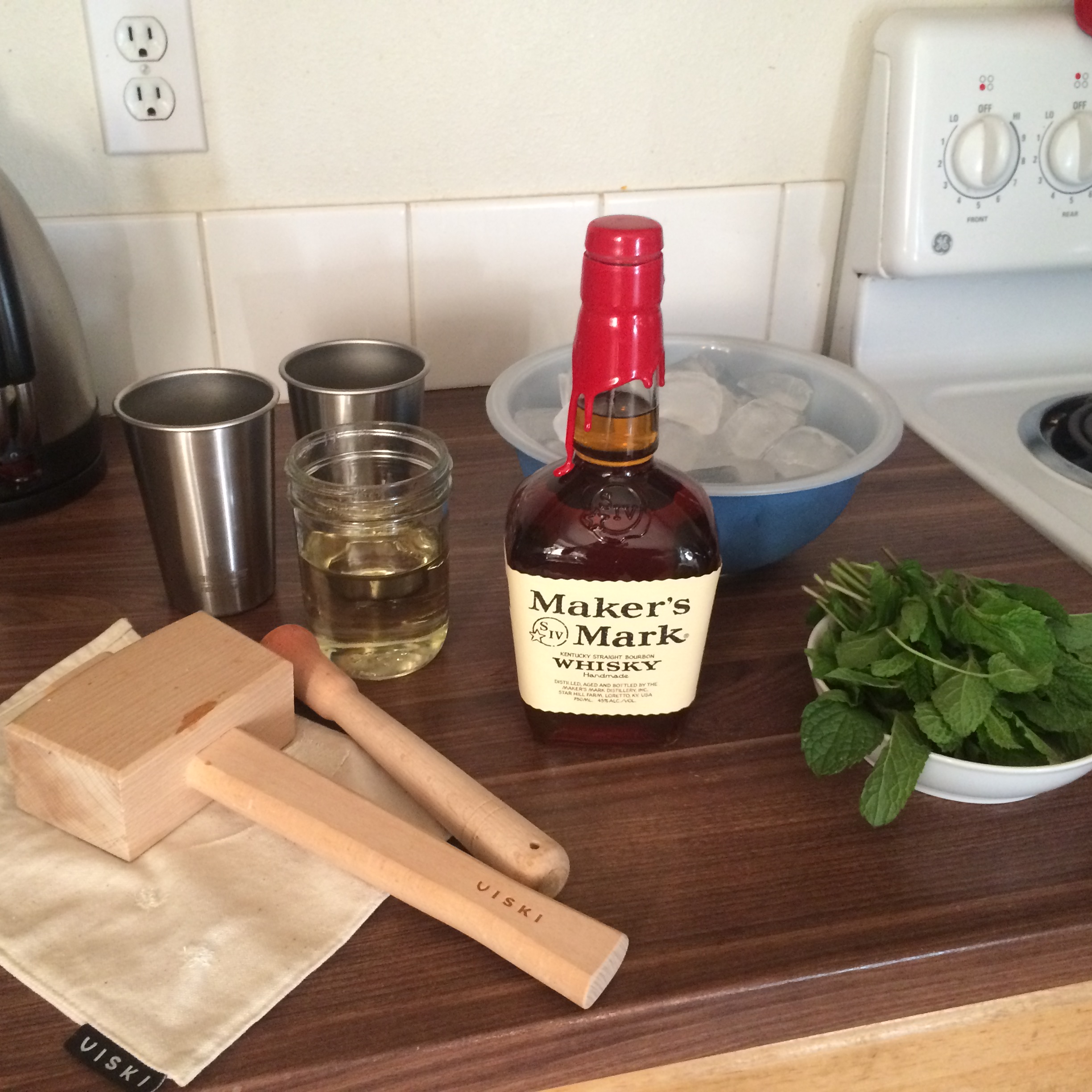 Simple syrup, mint, ice and bourbon